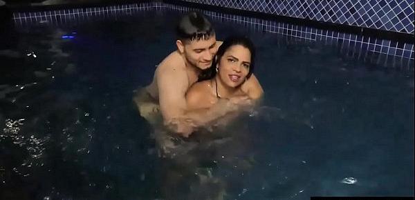  Voluptuous Shemale Sabrina Sousa and a Guy Make Out in a Swimming Pool